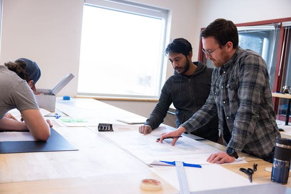 Two Students Drafting at Table 