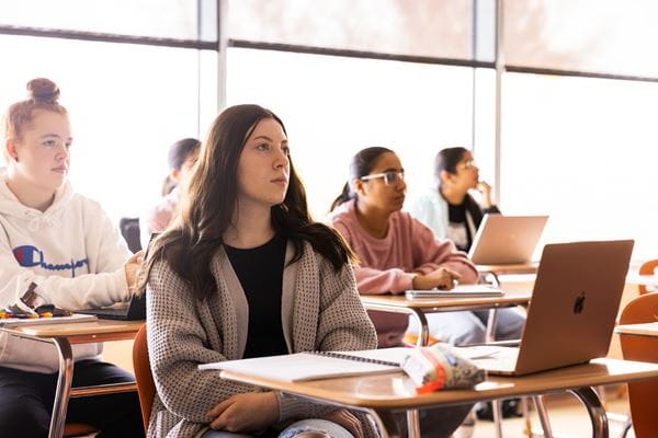 Business students learning in classroom. 