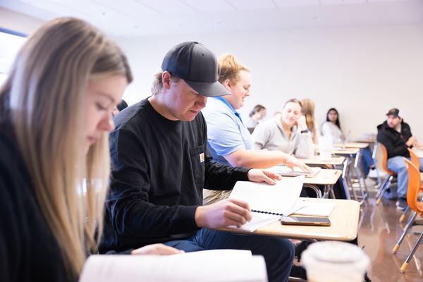 Business students learning in classroom. 