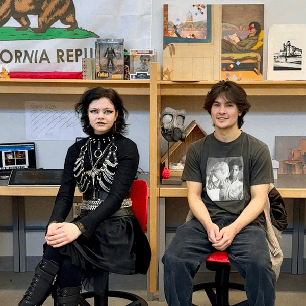 Art & Design students, Alannah-Mae R Medeiros and Zachary Fischer, sitting at their cubical desks.